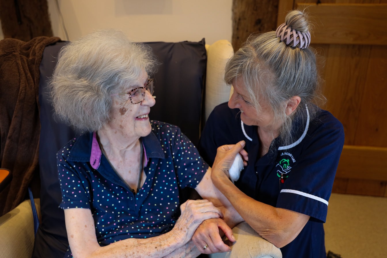 Carer with happy elderly lady